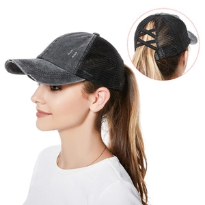 Detail of black denim mesh ponytail cap showing the crisscross back opening for hair