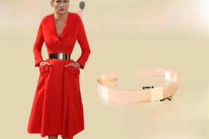 Detailed view of rose gold metallic wide waist belt with adjustable buckle on dress