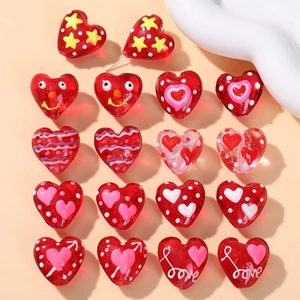 Colorful heart-shaped glass beads with smile and star patterns for DIY jewelry making