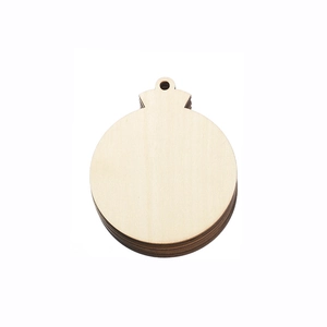 Flat lay of DIY wooden Christmas ball ornaments with top hanging holes on white background
