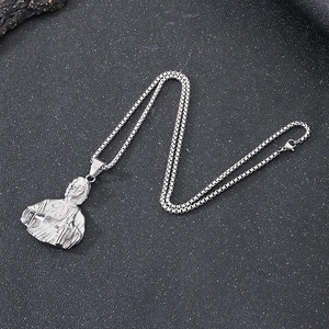 Vintage silver stainless steel box chain necklace with St. Jude bust pendant on dark surface