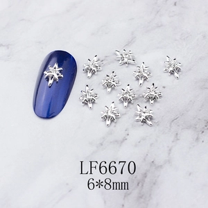 Detailed macro view of 6x8mm silver alloy star nail charms with clear rhinestones