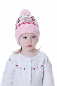 Close-up of knit winter hat with reindeer patterns, pink pom-poms and warm lining