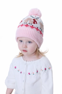 Close-up of pink knit kids hat featuring reindeer pattern and soft fleece lining