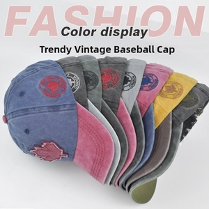 Close-up of washed cotton baseball caps with Canadian maple leaf embroidery in multiple colors