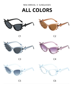 Flat lay of bat wing shaped cat eye sunglasses in six vibrant color variants and styles