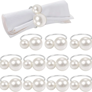 Elegant silver metal napkin rings with white pearls for wedding and banquet table decor