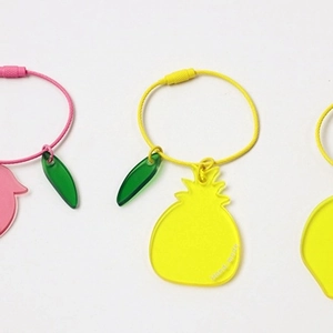 Cute transparent acrylic pineapple keychains in yellow and pink for airpods and bags