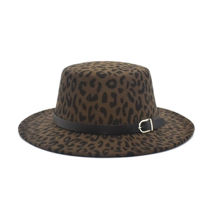 Detail of leopard print flat top fedora with black leather band and metal buckle