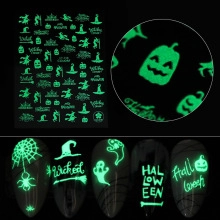 Luminous Halloween nail art stickers with glowing pumpkin and witch designs for manicure