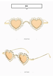 Vues détaillées de lunettes de soleil cœur dorées avec strass de luxe et verres ambrés