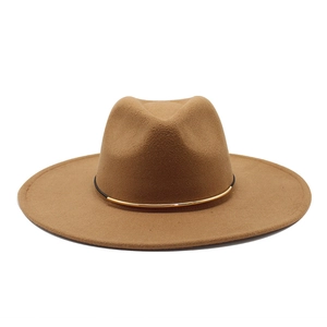 Detailed close-up of camel wool fedora hat featuring a gold buckle and black band trim