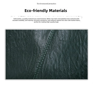Detail of dark green soft faux leather material with fine stitching and natural texture