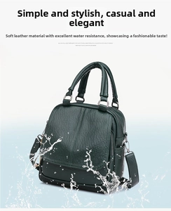 Detail of dark green soft leather bag showing waterproof surface with water splashes