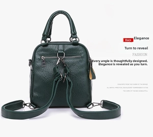 Detail view of the back anti-theft zipper pocket and straps on the dark green bag