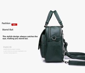 Detail view of multi-compartment green pebbled leather bag with sturdy zippers and handles