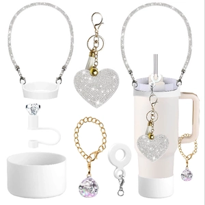 Close-up of silicone water bottle accessories set with sparkling rhinestones and heart charm