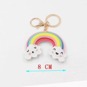 Detail view of cartoon PU leather rainbow keychain with smiley clouds and gold metal clasp