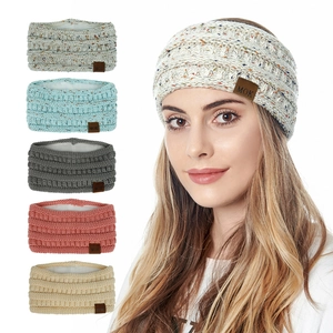 Detail showing plush lined knitted winter headbands in five colors with MOK leather patch
