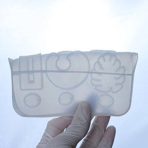Macro view of translucent silicone resin mold with geometric and tropical leaf shapes