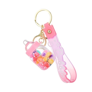 Pink milk bottle keychain with colorful beads and Bubble wrist strap on gold clasp