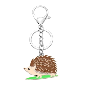 Creative hedgehog animal keychain with colorful enamel detailing on white background