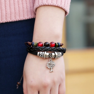 Handmade layered leather bracelet with tree of life charm and colorful wooden beads