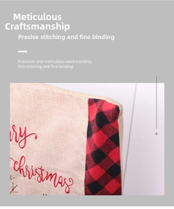 Close-up of Merry Christmas embroidery on linen chair cover with buffalo plaid edging