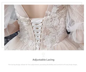 Detail of adjustable corset lace-up back on a lace wedding dress with beaded embroidery