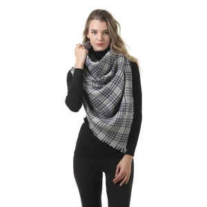 Detail of grey plaid cashmere-like scarf with soft fringe edges and thick woven texture