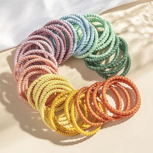 Colorful elastic hair ties for girls made of soft woven nylon fabric in a circular display