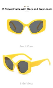 Macro detail of glossy yellow chunky frame and dark gray lenses of oversized sunglasses