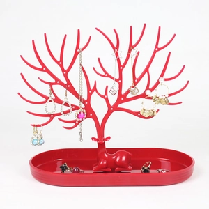 Creative red plastic deer antler jewelry stand with oval base for earring storage