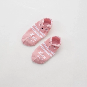 Detail of pink cotton baby socks featuring cute cartoon animal face and soft embroidery