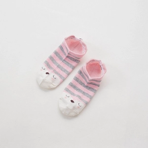 Close-up of pink and grey striped cotton socks with cute animal face patterns