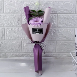 Detail of single purple soap flower bouquet with eucalyptus and Best Wishes ribbon