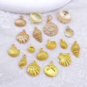Collection of 17 gold and rose gold metal shell and starfish charms for DIY jewelry making