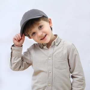 Classic kids grey baseball cap with beige long sleeve shirt on a child model
