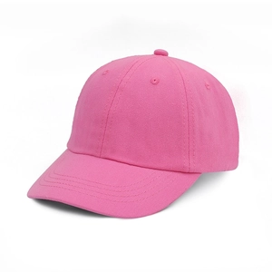 Detail of pink cotton baseball cap with classic six-panel design and curved brim