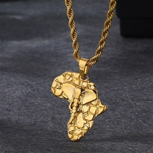 Close-up detail of gold-plated Africa map pendant necklace with rope chain for men.