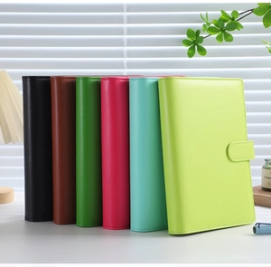 Colorful PU leather budget binders standing neatly on a desk in six pastel Macaron colors