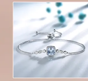 Detail of adjustable silver bracelet with square light blue gemstone and sliding clasp
