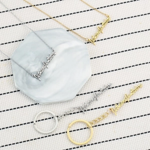 Gold and silver Je t'aime necklaces and Je t'adore keychains set in stainless steel