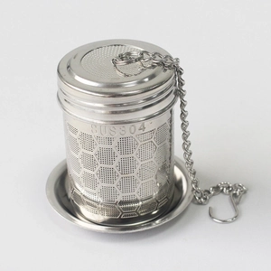 Macro view of SUS304 stainless steel tea infuser with honeycomb holes and chain hook