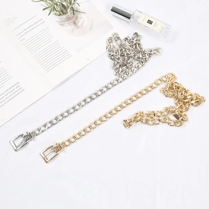 Close-up of gold and silver hip hop metal chains as stylish fashion accessories