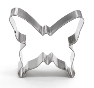 Close-up of a butterfly shaped stainless steel cookie cutter on a white background