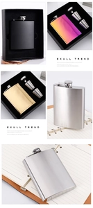 Macro shot of stainless steel hip flask set with black, gold and silver matte finishes