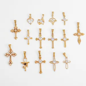 Gold-plated stainless steel pendants collection with crosses and heart shapes set with cubic zirconia