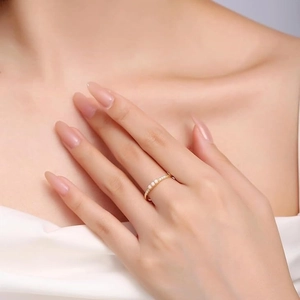 Elegant S925 sterling silver gold ring with three white opals worn by a model