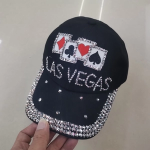 Detail of Las Vegas baseball cap with shimmering rhinestones and playing card patches